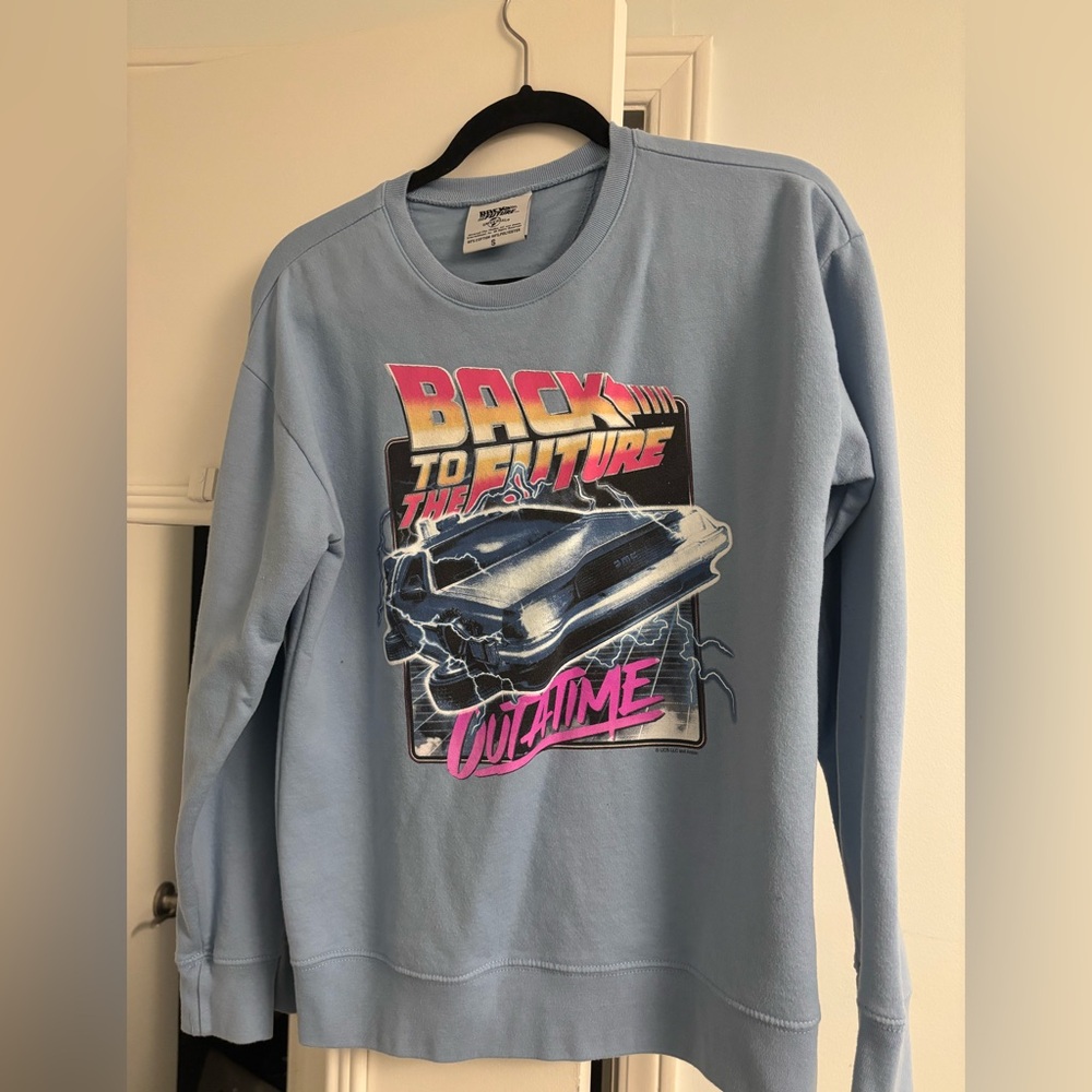 Universal Light Blue Back to the Future sweater. Size S